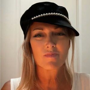 Eugenia Kim “Sabrina” Cap. Black velvet with an ivory pearl band